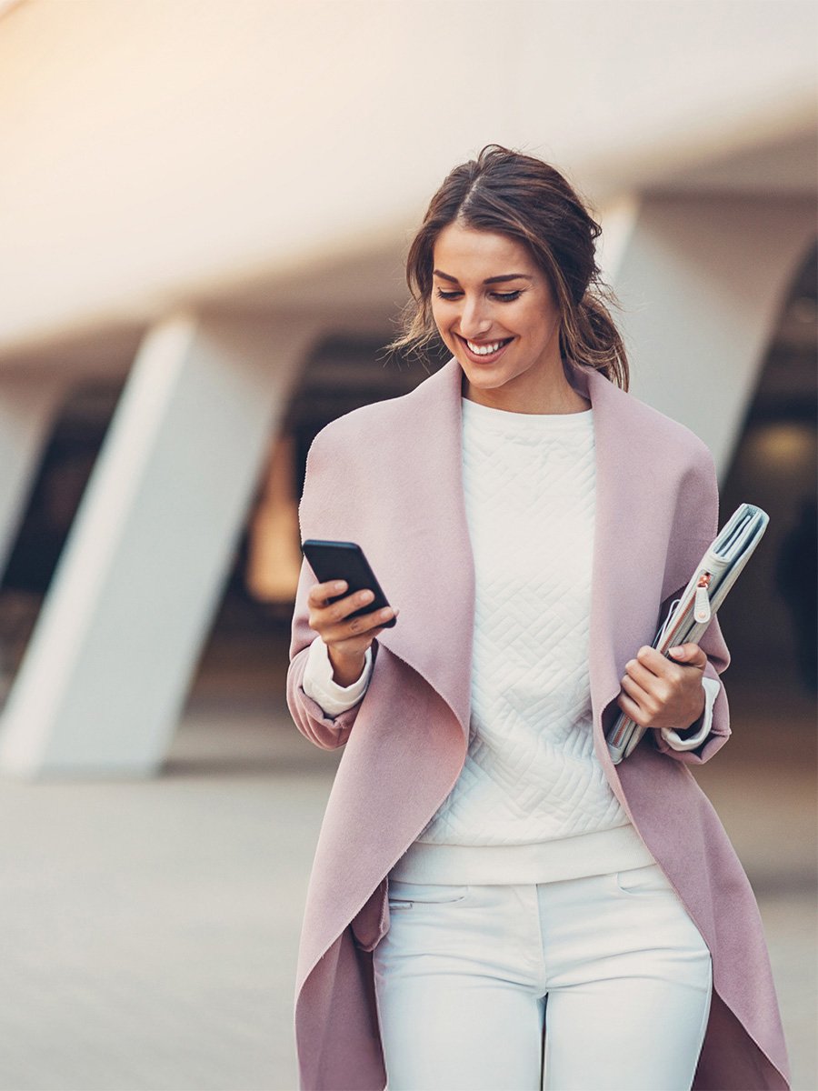 Life sciences marketer checking phone