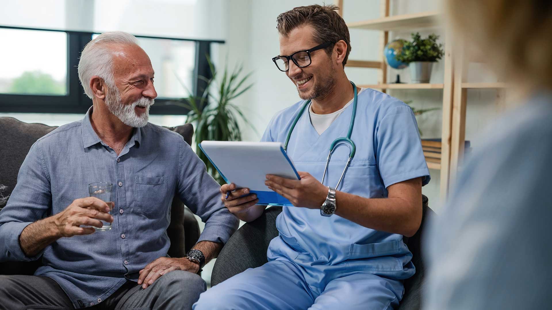 male healthcare provider with elder male patient