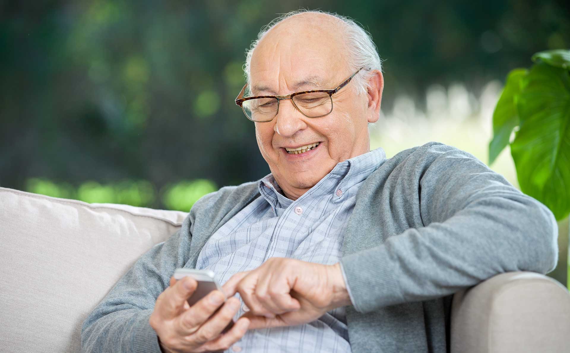 Elderly male using technology